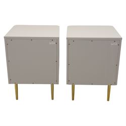 Made.com - 'Ebro' pair of grey bedside chests, gold painted metal shaped handles, rounded corners with fluted detail, raised on gold painted metal tapered supports