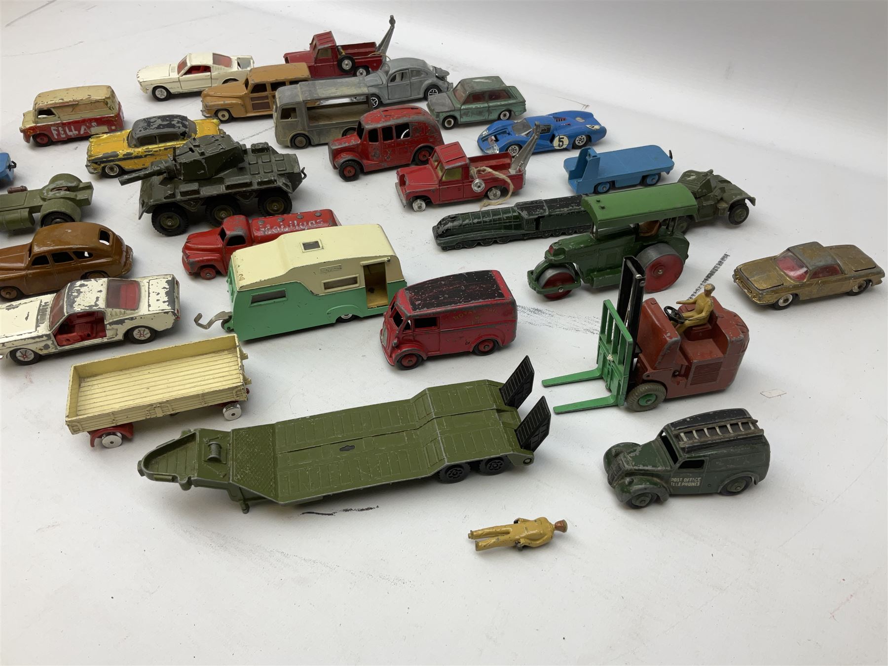 Dinky/Corgi - twenty-nine unboxed and playworn die-cast models including Mobilgas Tanker, two BEV Trucks, Aveling-Barford steam roller, Coventry Climax fork-lift, Hudson Hornet, Vanguard, Post Office Telephones Van, Royal Mail Van etc