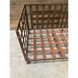 Wrought iron strapwork garden day bed, lattice back and sides