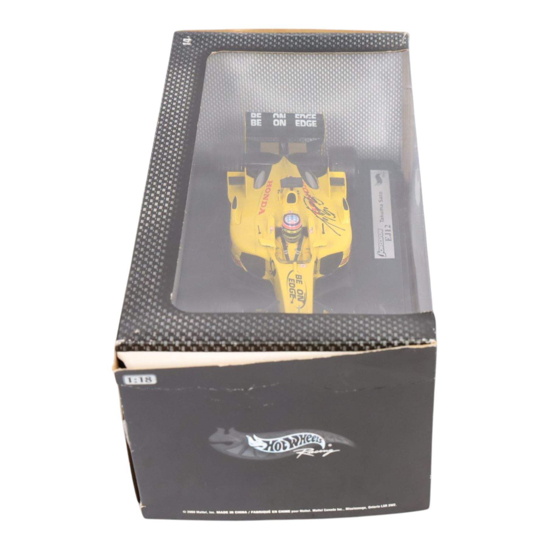 Three signed limited edition 1:18 scale Formula One models, comprising Hot Wheels Jordan EJ12 signed by Takuma Sato, Hot Wheels Jaguar Racing R2 signed by Eddie Irvine and a Minichamps Williams F1 Team model signed by Jenson Button, 1:18 scale model, all boxed