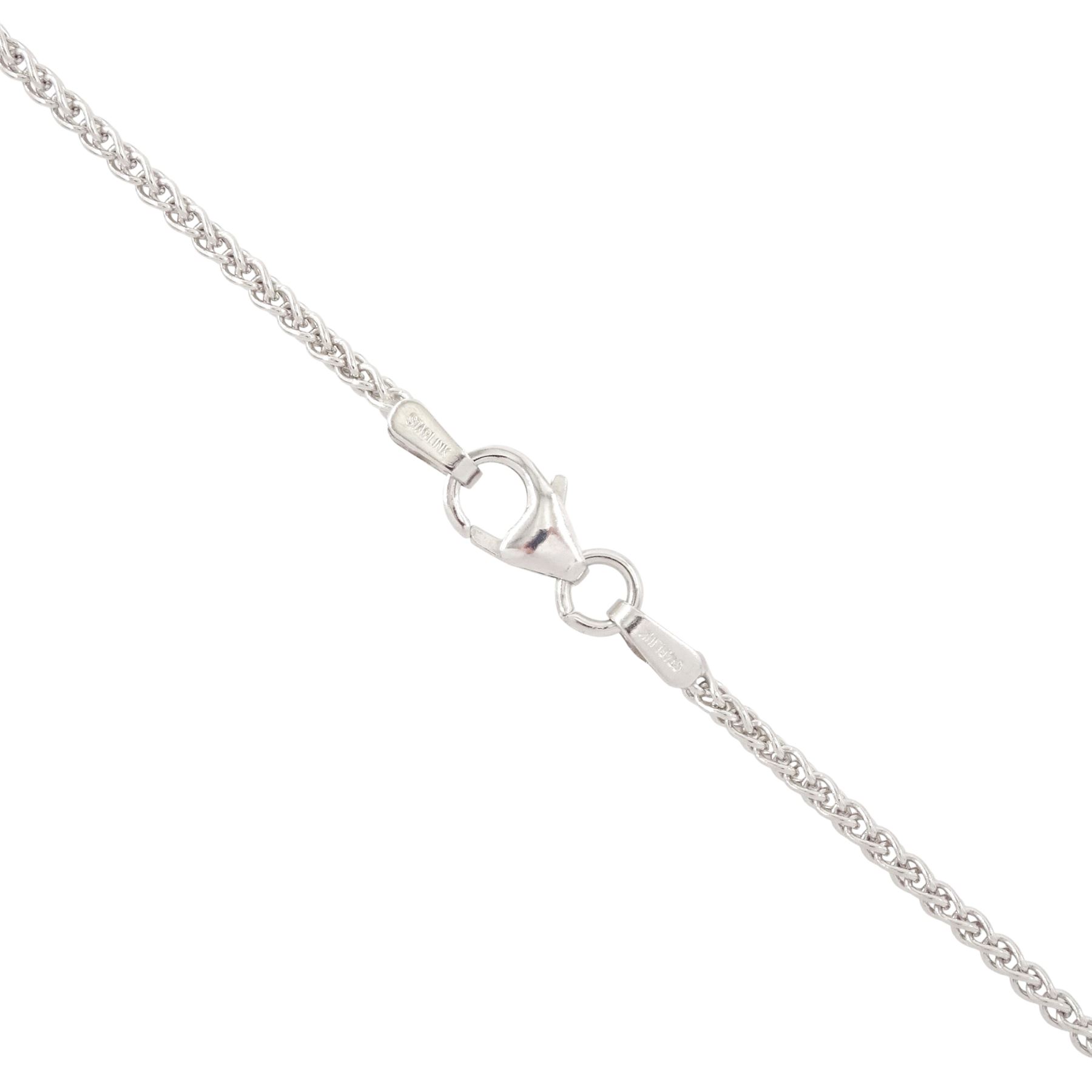 18ct white gold tanzanite and diamond pendant necklace, single oval cut light blue tanzanite of approx 3.25 carat, with diamond chip surround, on a wheat link chain necklace, both hallmarked