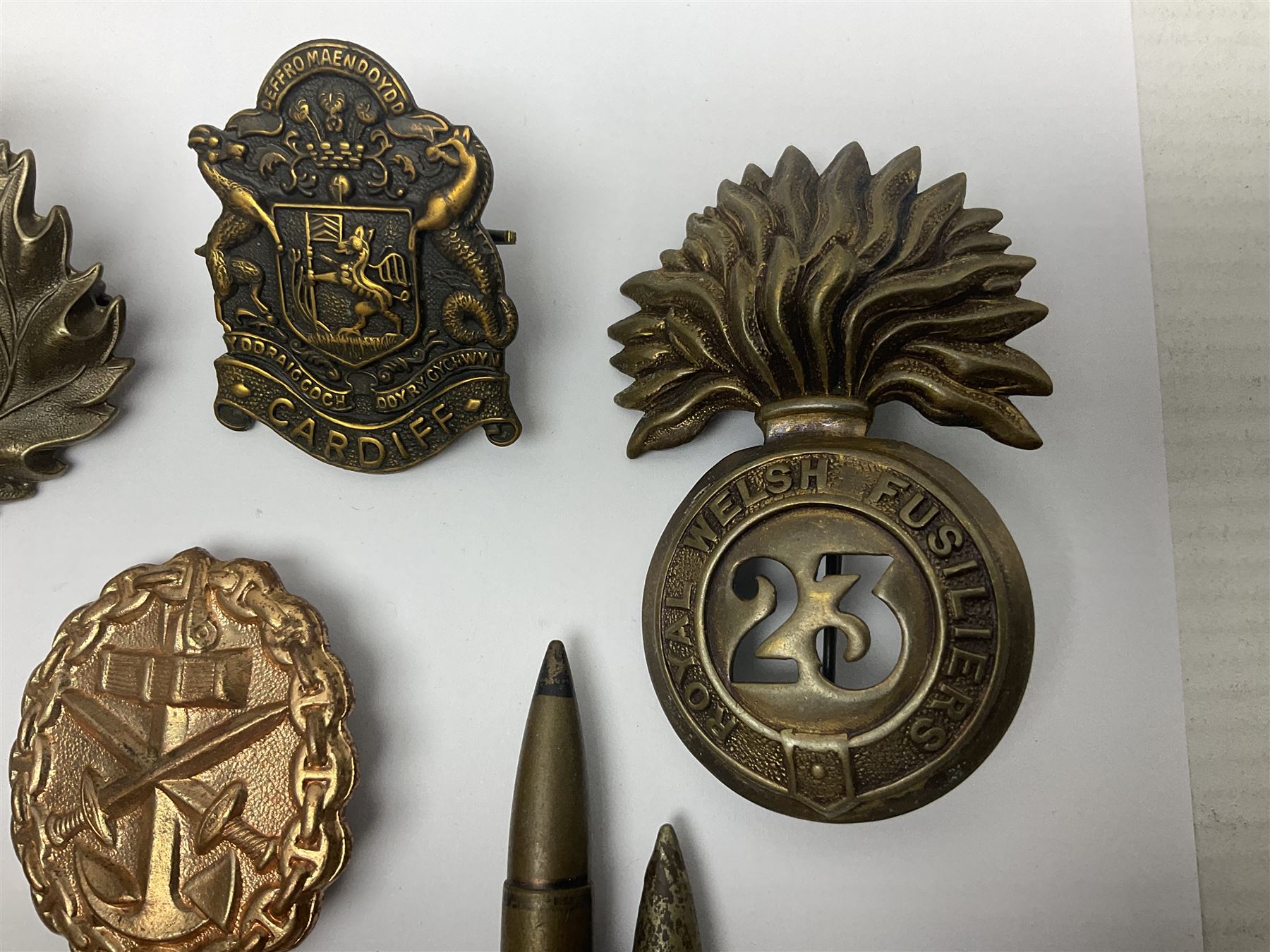 Two Edwardian hallmarked silver presentation fobs for military bugling competitions; and quantity of cap/glengarry and other badges, sweetheart brooches etc