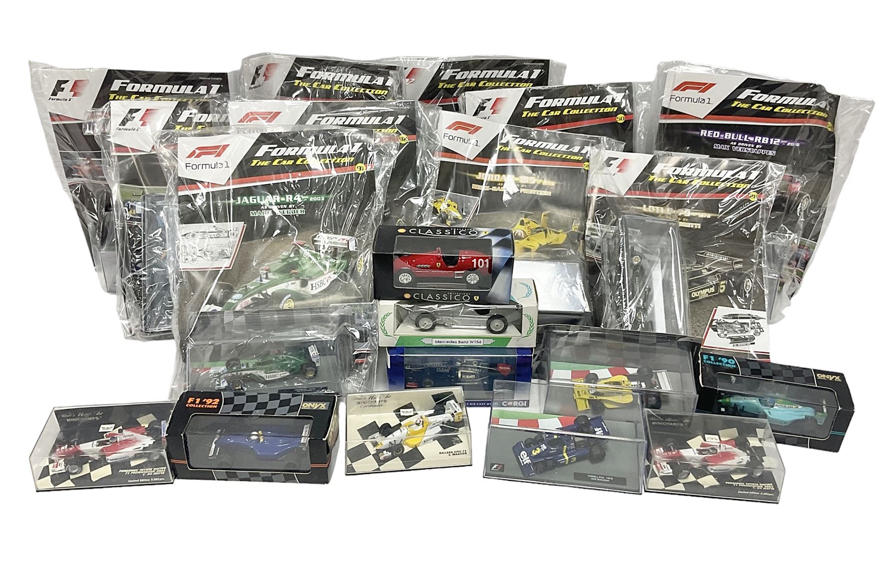 Panini Formula 1 The Car Collection - twelve die-cast models including ten in unopened packaging with periodical; all models in plastic display boxes; and eight other boxed die-cast models of racing cars by Corgi, Onyx, Classico, Minichamps etc (20)