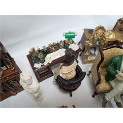 Dolls house living room and dining room furniture, including arm chairs, desk, fireplaces, dressers, tables, eight figures and a large collection of predominantly Christmas themed food, accessories and decorations