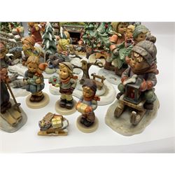 Large collection of Christmas themed Hummel figures and Hummel scapes by Goebel, to include Winter Friend, Making New Friends, Tree Trimming Time, Winter Adventure etc