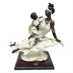 Giuseppe Armani Florence figure, Black Maternity, modelled as a mother and child upon a stylised cloud and mahogany base, H32cm