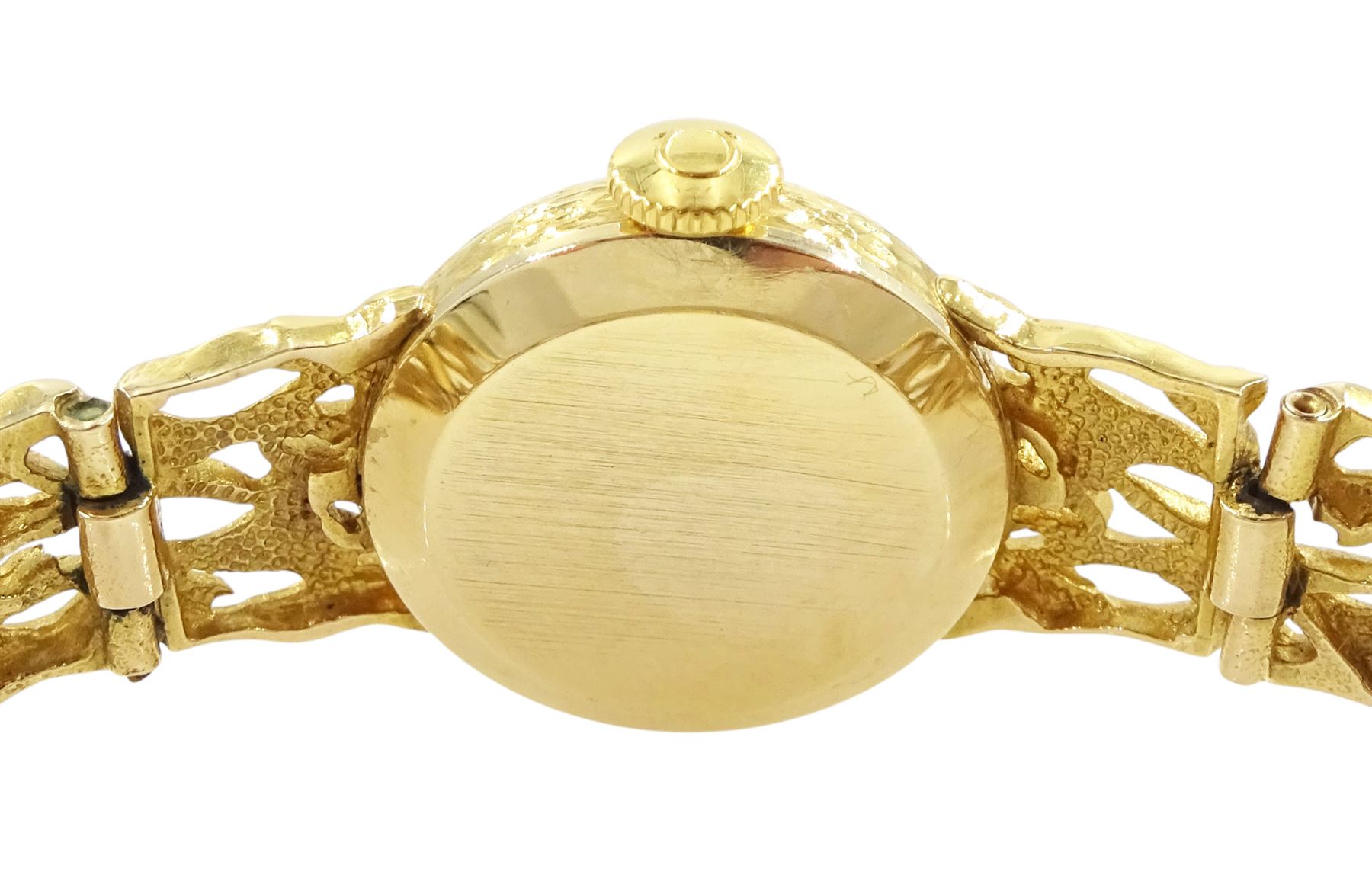 Omega ladies 9ct gold manual wind wristwatch, Ref. 7115674, silvered dial with baton hour markers, on 9ct gold pierced design bracelet, London 1972, with guarantee dated 1973