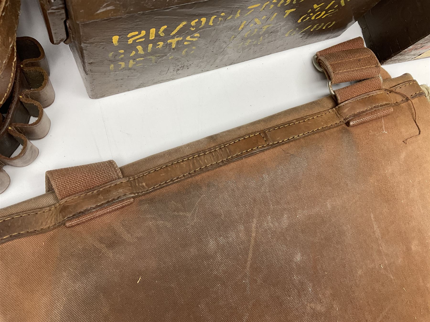 Miscellaneous shooting accessories - W.J. Bowman & Sons clay pigeon launcher; two leather cartridge belts; three cartridge bags; two canvas/leather game bags; and two metal/wooden cartridge boxes