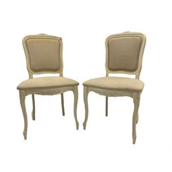 Pair French style side chairs, white finish and decorated with flower heads