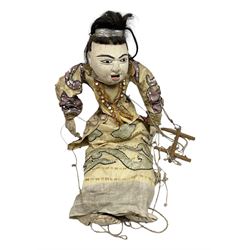 Large string puppet, probably Thai or Burmese, modelled as a woman in traditional costume embellished with sequins, the painted head with articulated mouth, the wood body and hands jointed, L70cm