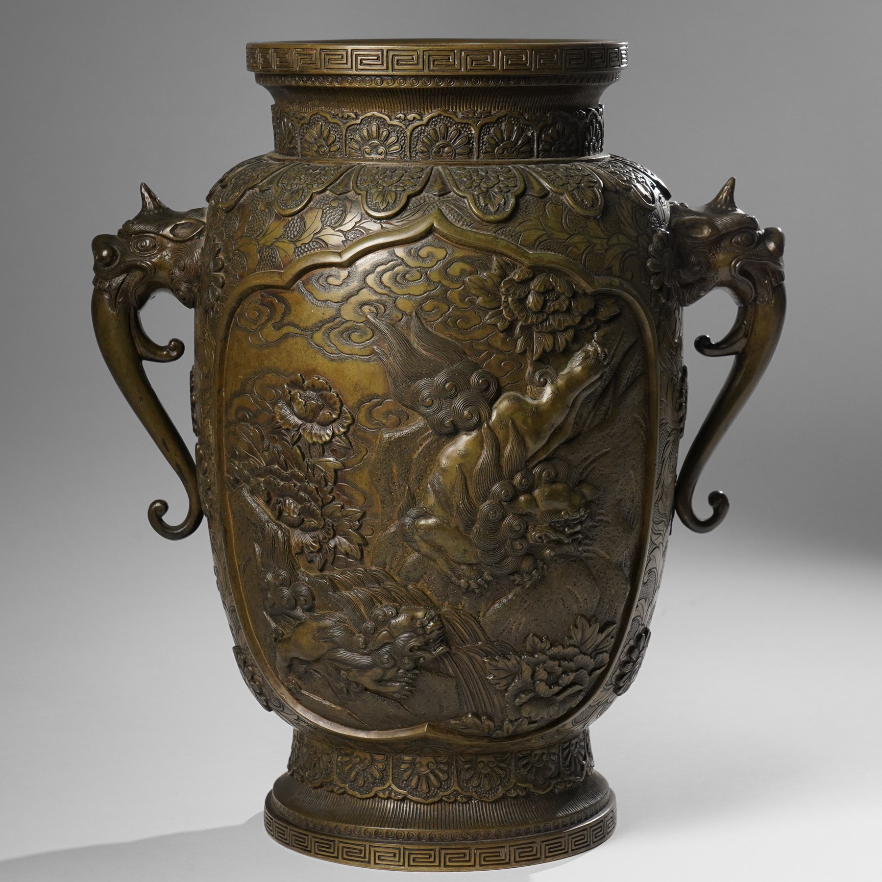 Japanese Meiji-Taisho period bronze vase, by Kanaya Gorosaburo, decorated with dragons and other creatures in a landscape, seal mark to base, H35.5cm 