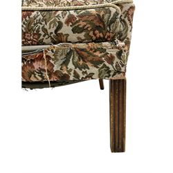 Parker Knoll - mid-20th century wingback armchair, upholstered in tapestry style floral fabric, raised on square moulded supports 