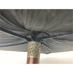 Victorian magician's cane, the mahogany walking stick twisting apart to reveal an internal mechanism, opening to tripod and black silk fold out magician's table, with horn handle and silver mount, hallmarked Birmingham 1891