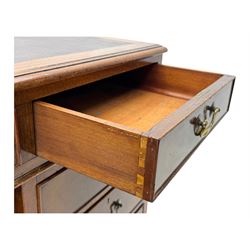 Edwardian mahogany twin pedestal desk, rectangular burgundy leather top moulded edge, over three short drawers with brass swan neck handles, over twin pedestals with graduating drawers supported on bracket feet