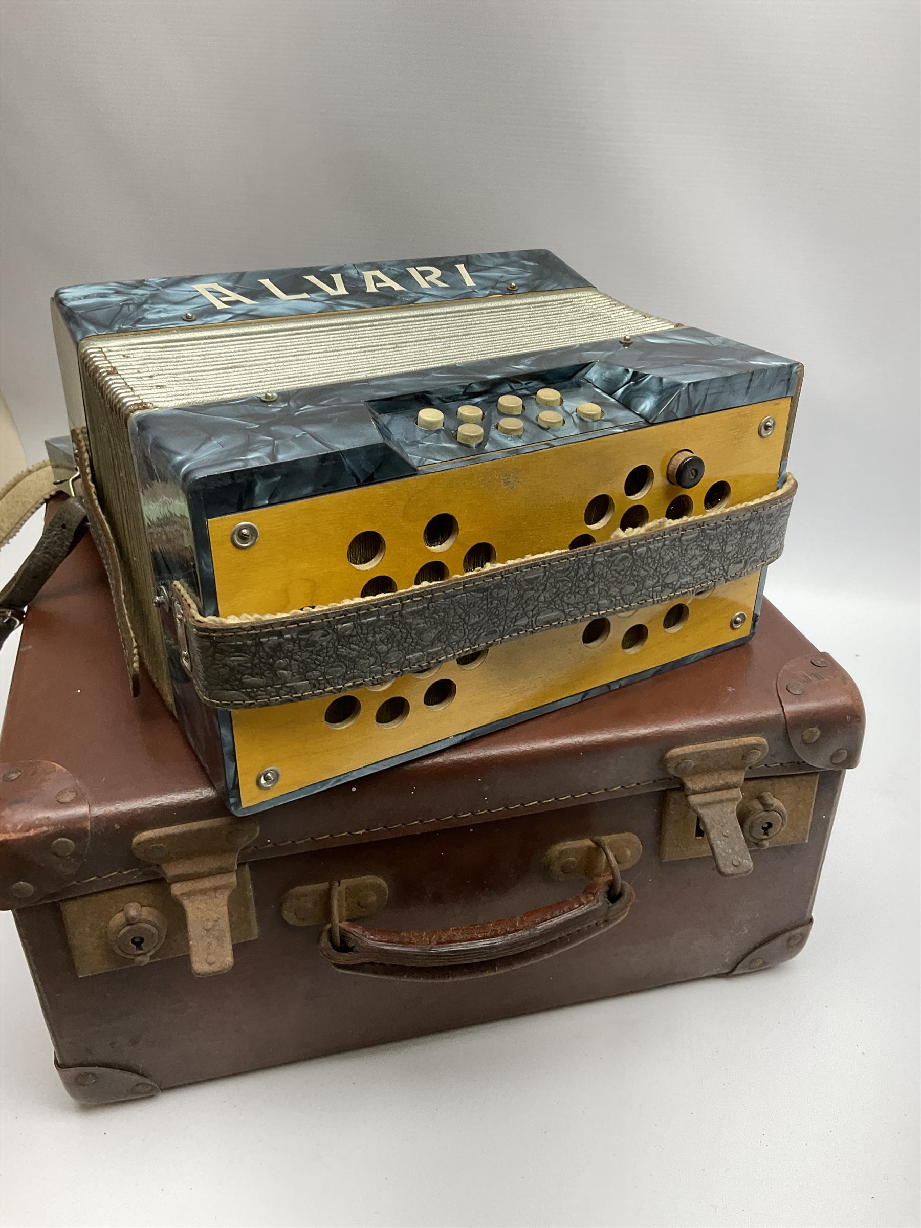Small German Alvari piano accordion with blue pearline case, thirteen keys and eight buttons L30cm; in carrying case