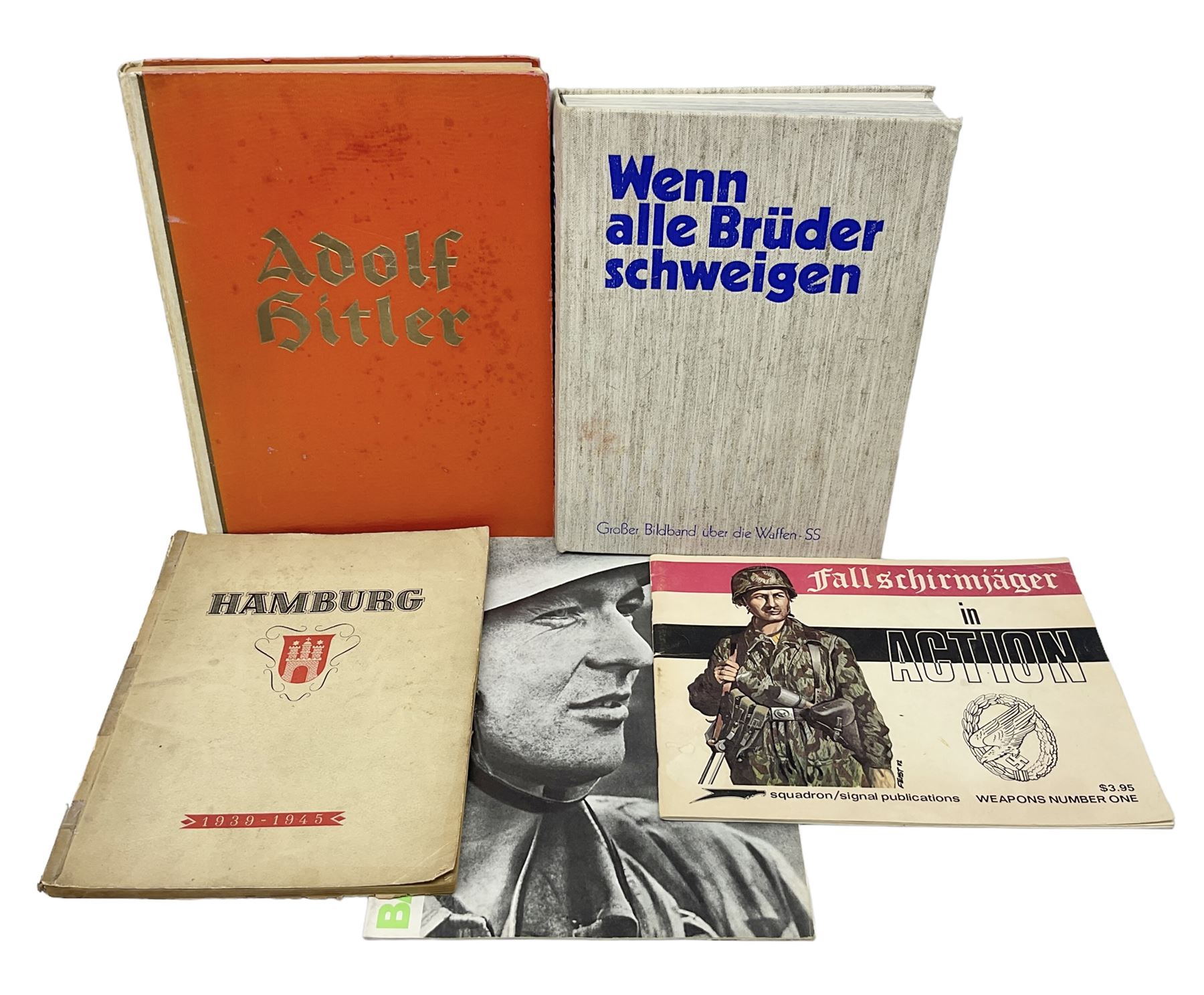 Adolf Hitler, Bilder aus dem Leben des Fuhrers [Pictures from the Life of the Fuhrer], Herausgegeben vom Cigaretten / Bilderdienst, Hamburg / Bahrenfeld, 1936, an album of two hundred tipped-in cards bearing photographs by Heinrich Hoffman, originally collected with cigarettes, 31 cm x 24 cm; together with a Waffen-SS book 'Wenn alle Bruder schweigen'; Hamburg 1939-1945; and two other booklets