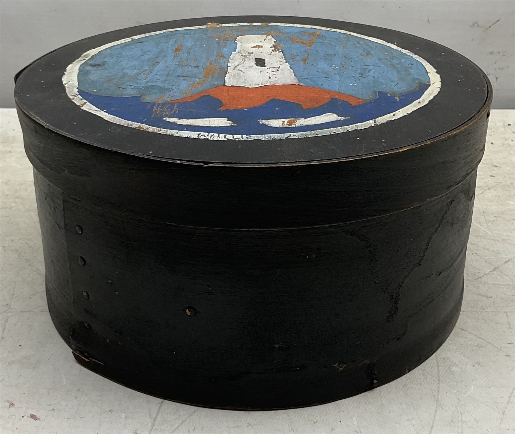 Attrib. Alfred Wallis (British 1855-1942): The Lighthouse, oil on circular wooden box signed, diameter 22cm height 11cm