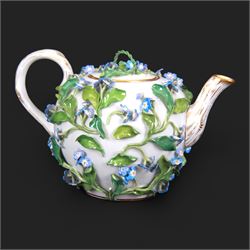 Late 19th century Meissen teapot, of ovoid form with gilt detailed 'crabstock' effect handle and spout, the body encrusted with forget-me-not flowers and leaves and painted with a single moth, with underglaze blue crossed swords mark beneath, H10cm