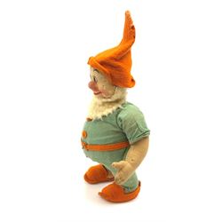 Chad Valley pressed felt figure of the Disney Snow White dwarf 'Doc' with painted facial features, standing wearing a green linen suit with orange hat, belt, buttons and shoes H13
