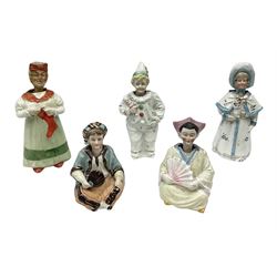 Five Victorian and later nodding figures, including a clown and women in  bonnet and shawl holding a dog, largest example H20cm