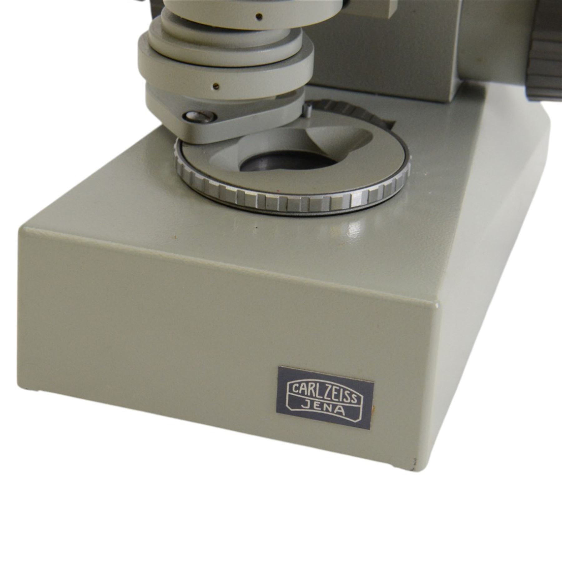 Three microscopes, including Griffin Student Vernier Microscope, Vickers Instruments binocular microscope with Leitz Wetzlar Periplan 10x lenses, and a Carl Zeiss Jena binocular microscope in a wooden Olympus Tokyo box