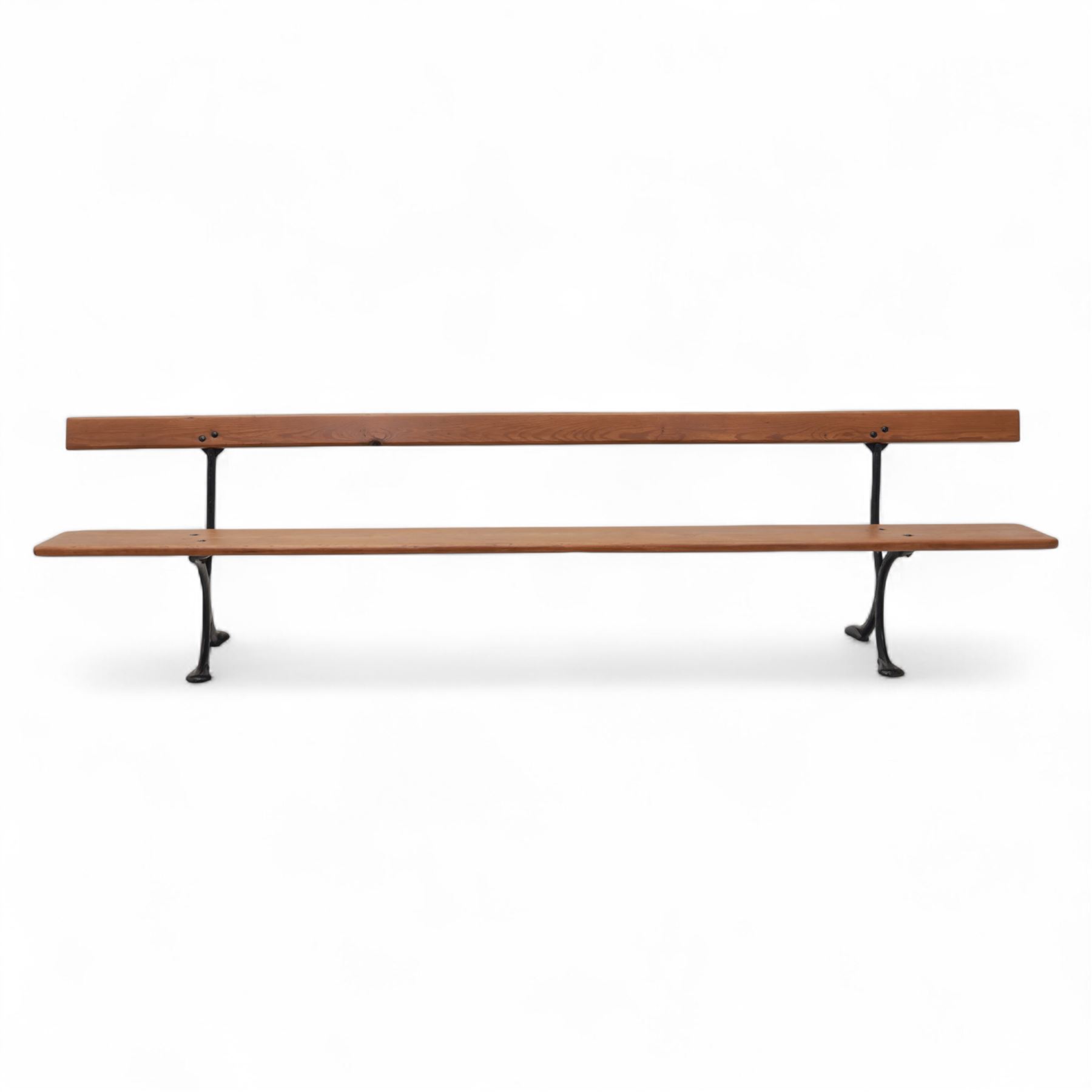 Pine garden bench, with stained and weatherproof varnish, single slat pine seat and back, raised on curved black cast iron supports