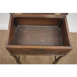  18th Century and later oak table/bible box, heavily carved hinged top and sides, on turned supports joined by stretchers, W57cm, H71cm, D40cm  