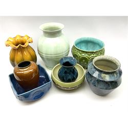 A group of assorted pottery, to include a large ribbed vase, of ovoid form with celadon type glaze, H29.5cm, reeded vase with frilled rim and merging yellow and brown glaze, H23.5cm, Irish Youghal vase, Brook New Forest vase, square sided blue glazed square sided bowl with pinched corners, etc. 