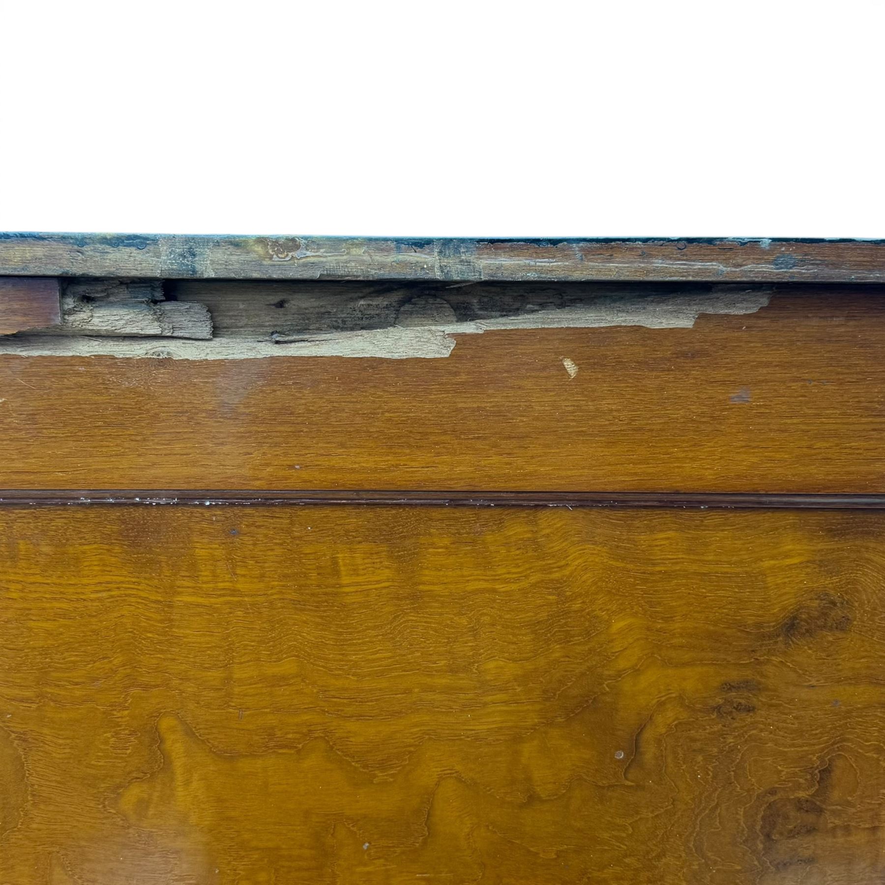 20th century black painted camphorwood lined tool chest, rectangular hinged lid over moulded edge, black painted exterior with iron straps and carry handles, the interior fitted with sliding lidded trays and drawers with turned handles, containing an assortment of hand tools