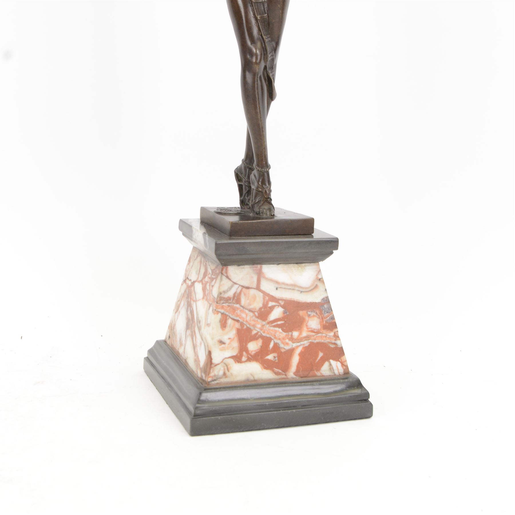 After Demétre Haralamb Chiparus (Romanian 1886-1947): Art Deco style bronze figure modelled as a dancer with raised arms, signed to the stepped bronze base and also bearing foundry stamp, upon a tapering marble plinth, overall H55cm
