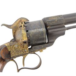 French six shot percussion and pinfire revolver, round barrel 2cm, numbered 1 F 75344 beneath and Brevete Paris on the other side, cylinder and frame overlaid with gold vine leaves, tendrils and lines; with ejector rod on the right, plain wooden grip, and lanyard ring
Sold as an exempt item under Section 58 (2) of the 1968 Firearms Act, to be held as a curiosity or ornament