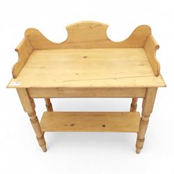 20th century pine washstand, shaped three-quarter gallery back over rectangular top, raised on turned supports with lower undertier