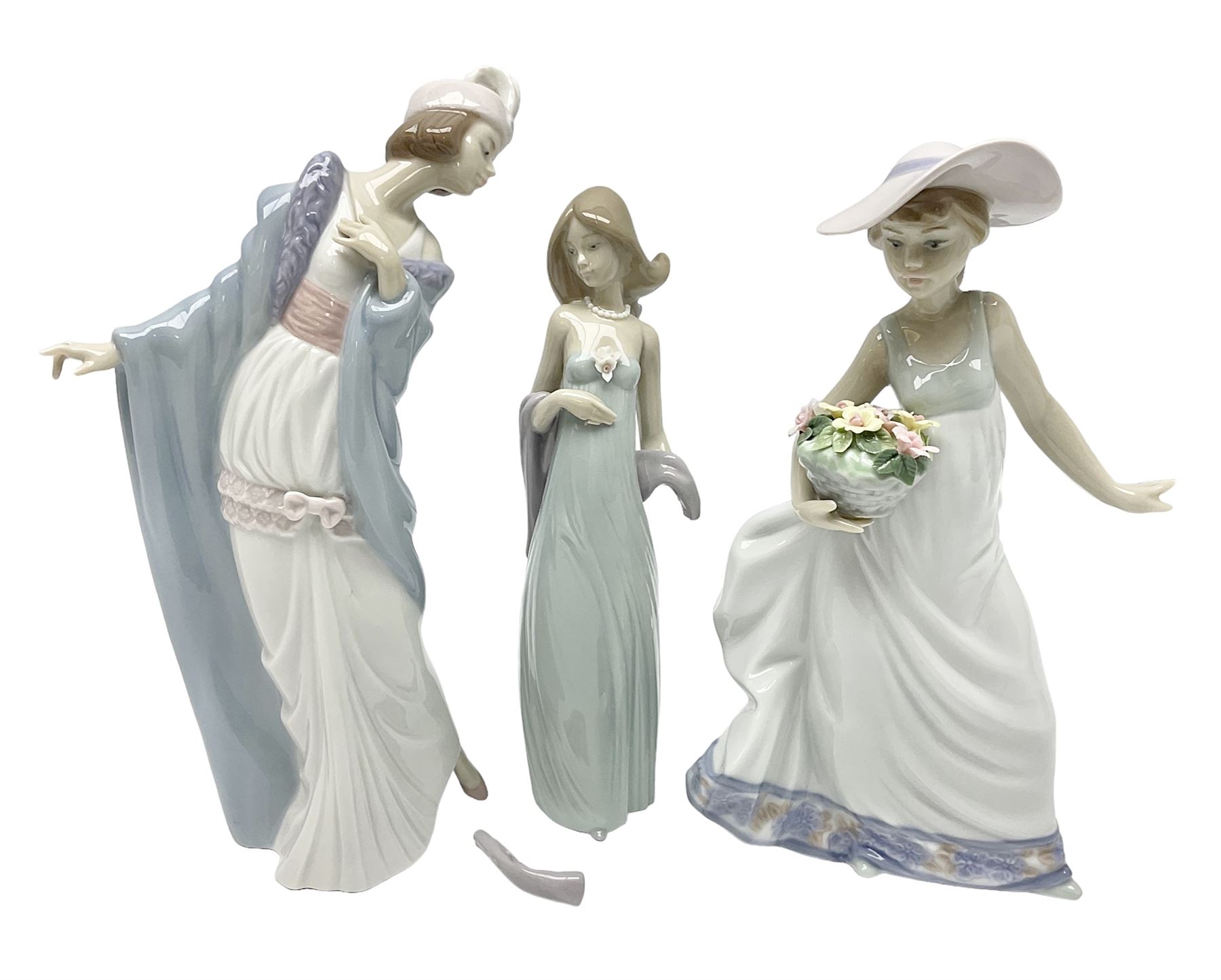 Three Lladro figures of ladies comprising 'The Flirt' model no 5789, 'Ingenue' model no 5487 and 'Carefree' model no 5790, all with boxes