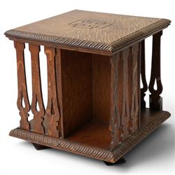 Early 20th century tabletop oak revolving bookcase, of square section upon short platform base 