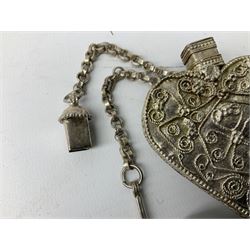 Eastern white metal scent bottle of heart form, above a crescent moon and petal shaped base with hanging chain and pin, L10cm