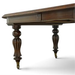 Large Victorian Country House mahogany extending dining table, the oval top with moulded edge over a plain frieze, raised on five large turned and reeded supports, with winding extending mechanism and additional leaf