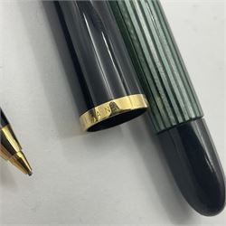 Pelikan Souveran 140 fountain pen, the green and black striped barrel with gold plated beak shaped clip and bands, with gold nib stamped 14C-585, together with matching twist ballpoint pen, push ballpoint pen and propelling pencil, largest approx L13.5cm (4)