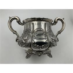 Victorian silver three piece tea service, comprising teapot, twin handled open sucrier, and milk jug, each of bellied form with acanthus capped scroll handles, the sides embossed with alternating scroll edged vacant panels and panels containing a pair of birds, upon four palmette feet, the teapot with ivory insulators to handle, and bird finial to the hinged domed cover, hallmarked William Hunter & Son, London 1861, teapot H19cm, including handles sucrier H13.5cm, including handle milk jug H12cm

This item has been registered for sale under Section 10 of the APHA Ivory Act