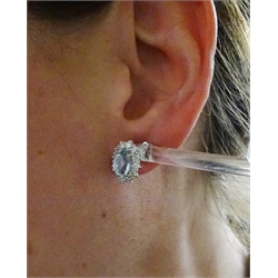  Pair of 18ct white gold aquamarine and diamond cluster earrings hallmarked, aquamarine total weight approx 2.10 carat, diamond total weight approx 1.10 carat  