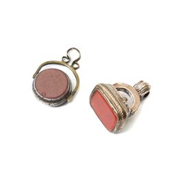 Collection of ten 19th century agate knife handles of varying designs, paperweight of octagonal design, swivel fob seal and a pinchbeck seal