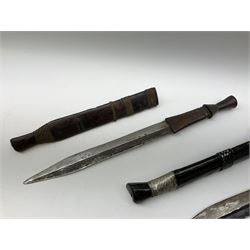 Mid-20th century Rhodesian short sword/knife with 34.5cm steel blade, turned and carved ebonised grip with metal thread binding and silvered decoration and matching scabbard L51cm overall; and another similar Rhodesian metal thread bound hardwood short sword and scabbard (2)