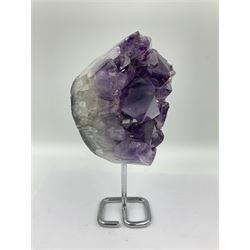 Amethyst crystal geode cluster, with large well-defined crystals, upon a metal stand, H21cm