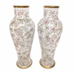 Pair of glass vases, of baluster form, painted with floral and foliate decoration, with gilt base and rim, H27.8cm