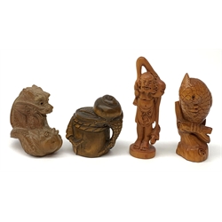 Four carved wooden Japanese netsukes, modelled as a dragon, two snails upon a log, a bird perched upon a branch, and a fisherman with figure upon his back, each signed beneath. (4). 