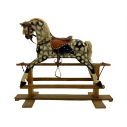 Collinson - early 20th century carved wood rocking horse, on trestle base with tack