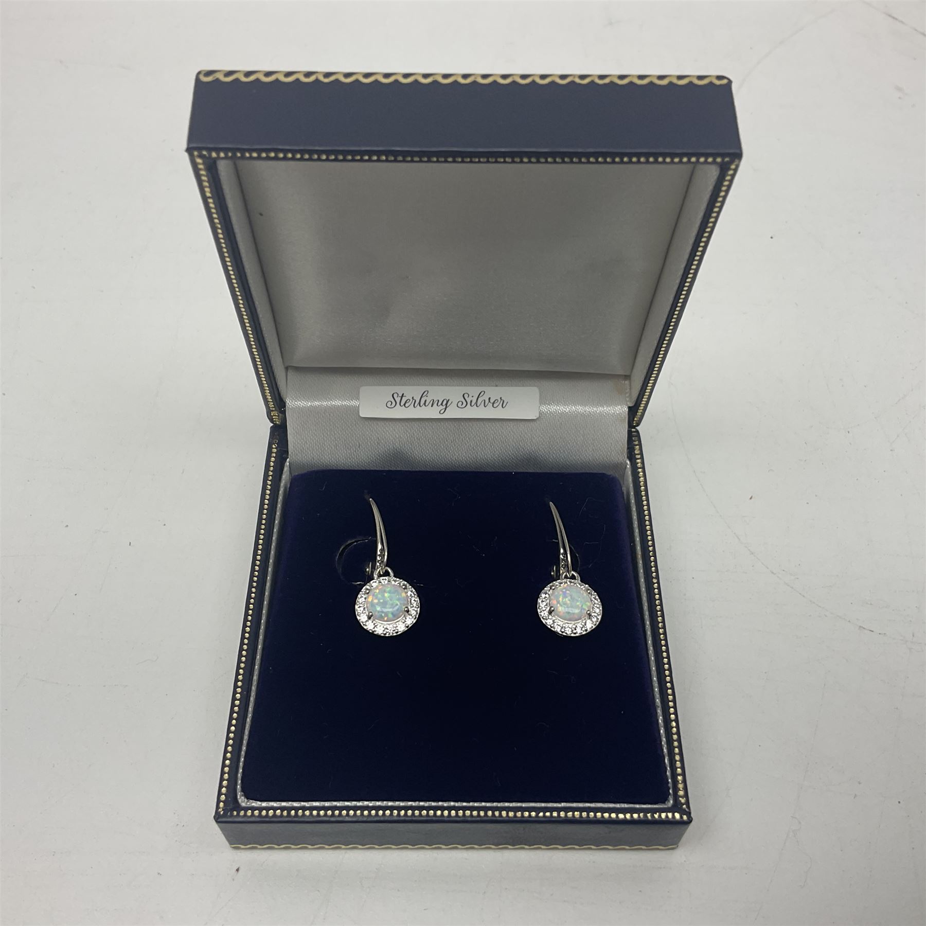 Pair of silver opal and cubic zirconia cluster pendant earrings, stamped 925, boxed 