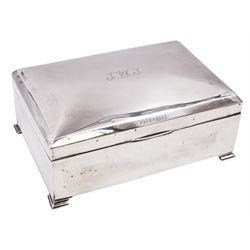 1920s silver mounted presentation cigarette box, of rectangular form, with engraved initials J.W.J and dated 1902-1927 to slightly domed hinged cover, opening to reveal compartmentalised softwood interior, upon four bracket feet, hallmarked Birmingham 1920, maker's mark worn and indistinct, H9cm, W23cm, reputedly given to John William Johnson, father of Amy Johnson,  famous for being the first long distance (to Australia) solo female pilot, and first female British grounds engineer, for his silver wedding anniversary