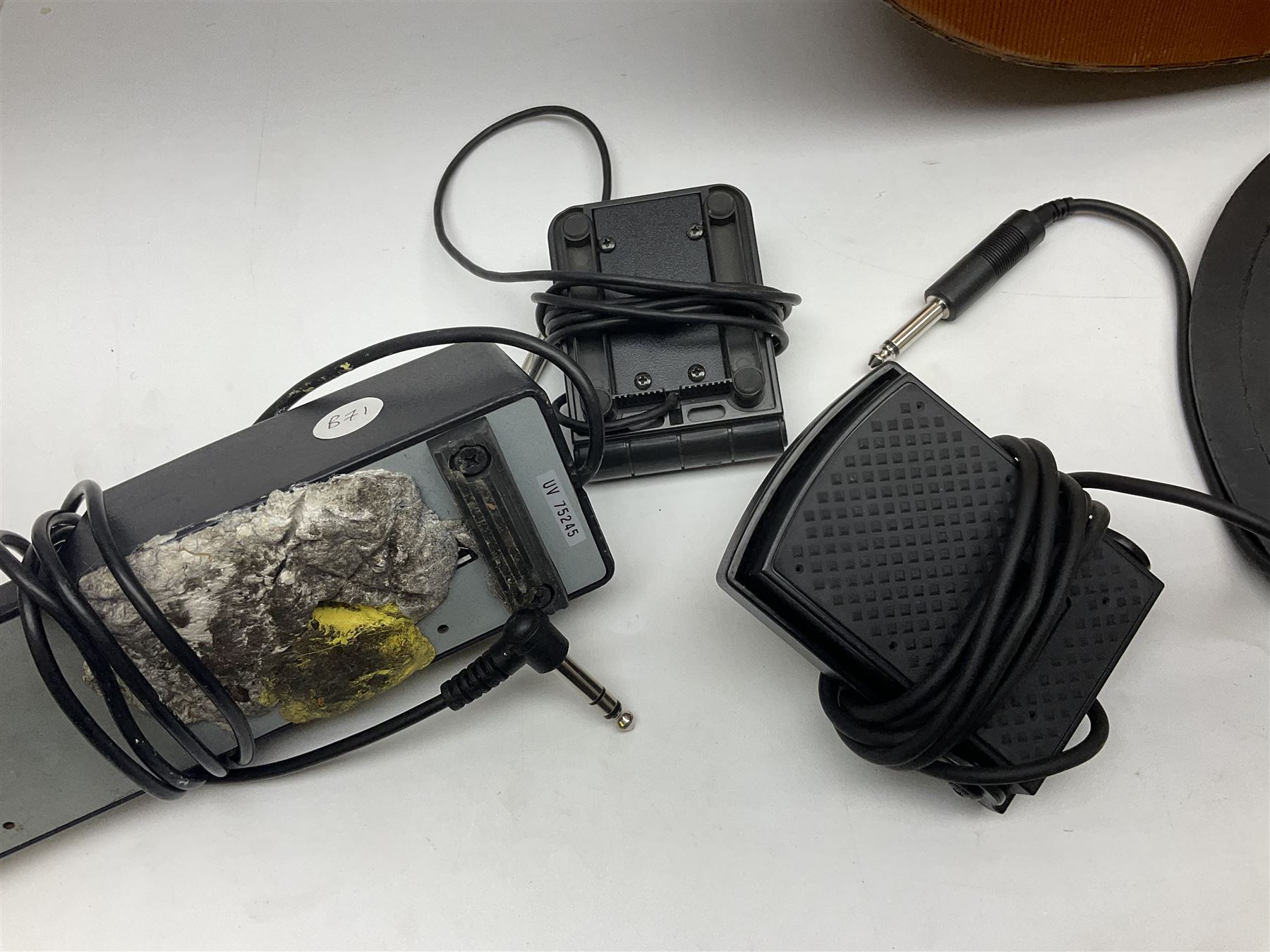 Spanish BM acoustic guitar with mahogany back and sides and spruce top L101cm; in cello carrying case; Roland foot pedal and two Yamaha foot pedals; tin D# organ pipe; folding music stand etc