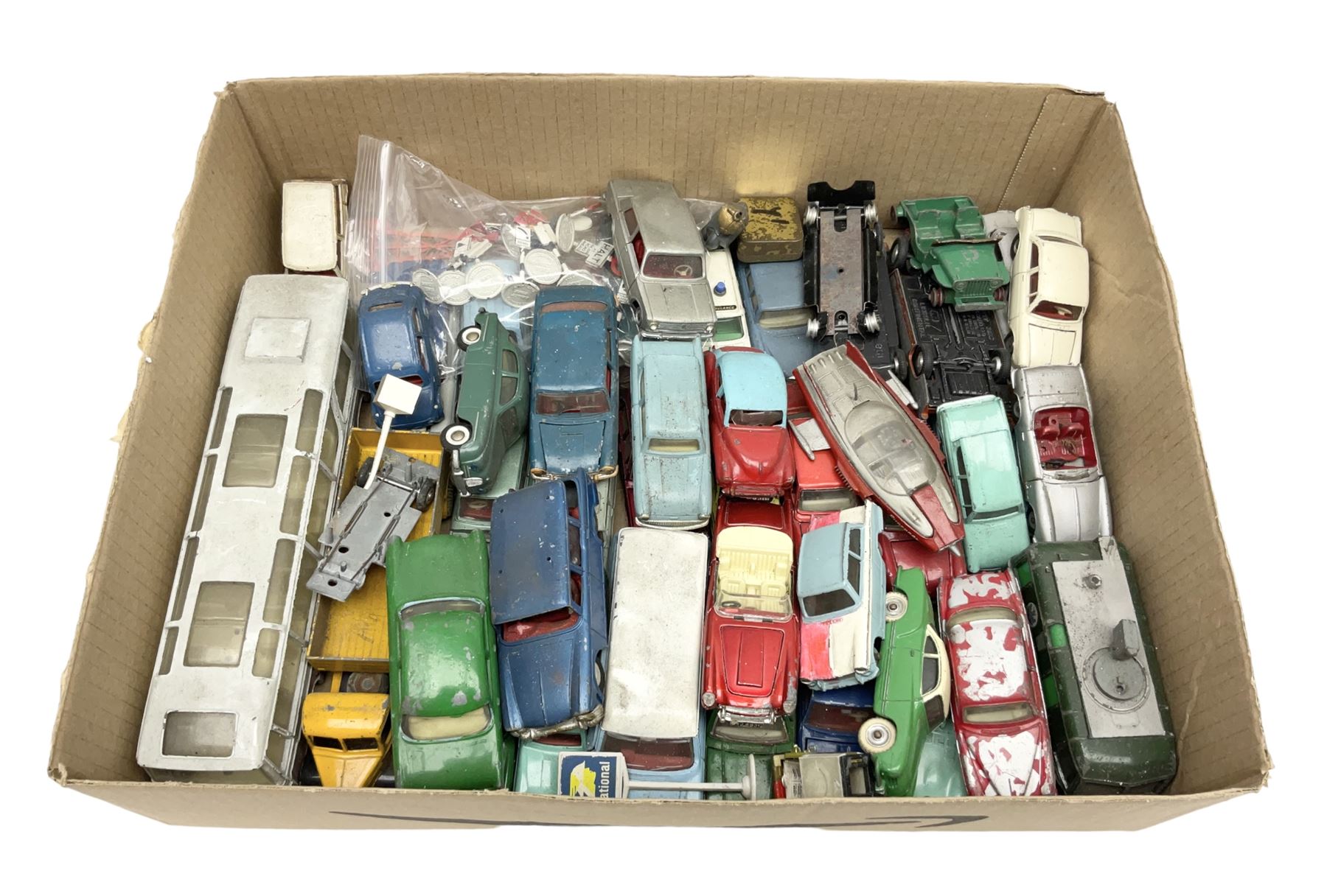 Dinky - over thirty unboxed and playworn die-cast models including Vega Major Luxury Coach, Peugeot 404, Humber Hawk, Ford Transit Van, Jaguar Type D etc; fourteen Dinky road signs; and quantity of other models including Budgie Supercar, Tri-ang Spot-On, Tekno etc