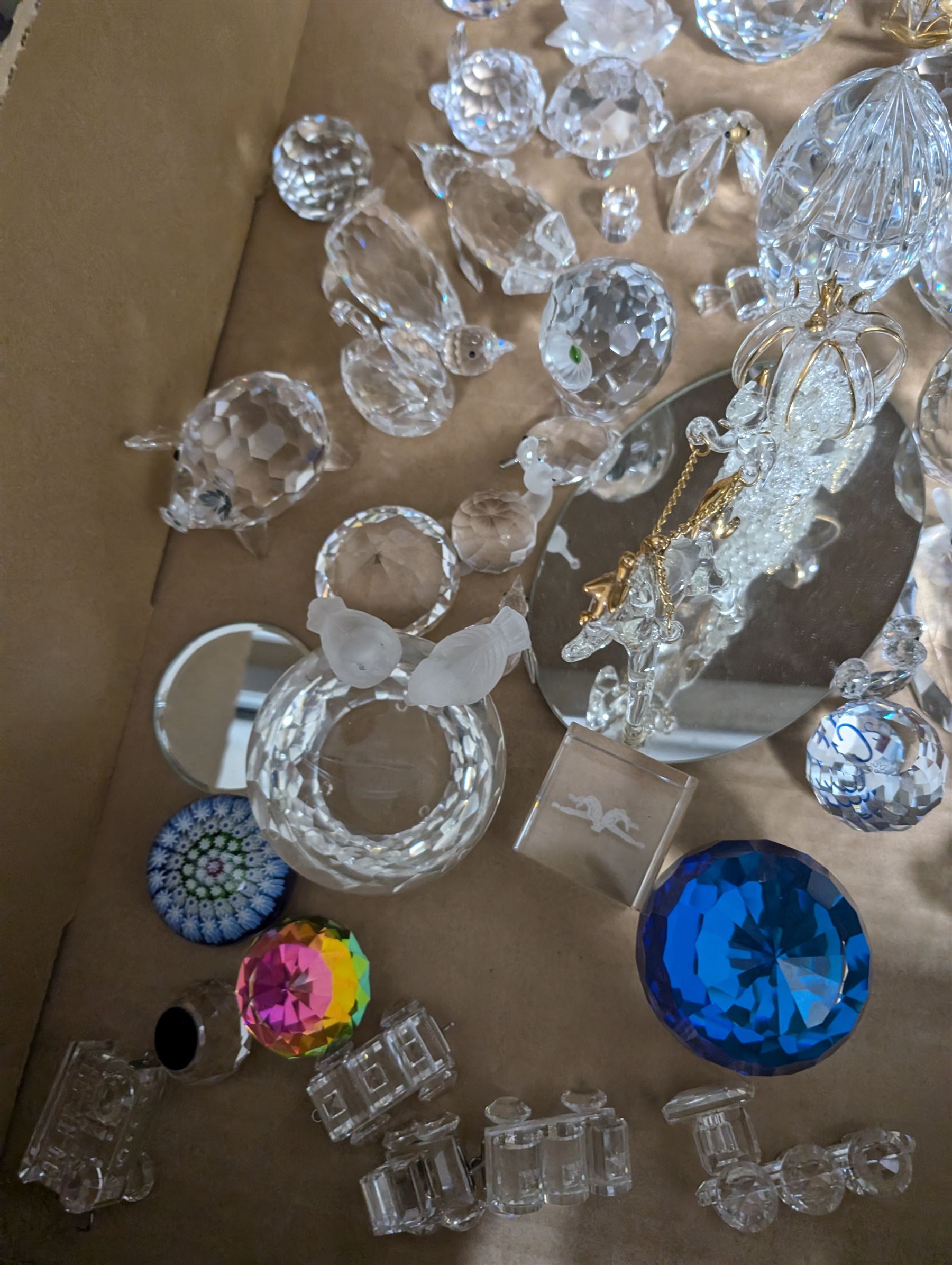 Collection of Swarovski figures, including owls, cats, penguins etc, together with Perthshire paperweight 